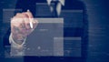 Businessman using a stylus pen to interact with a virtual interface displaying floating computer code and data, emphasizing Royalty Free Stock Photo