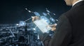 Businessman Using Tablet with Digital Interface for Data Analysis and Communication in a Modern City Background with Royalty Free Stock Photo