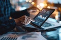 Businessman using tablet and laptop to analyze sales data and stock market chart. Business strategy Royalty Free Stock Photo