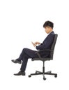 Businessman using tablet pc on the chair Royalty Free Stock Photo