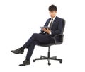 Businessman using tablet pc on the chair Royalty Free Stock Photo