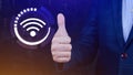 Businessman using thumb up with wifi icon. Social network business communication concept, Wifi wireless concept free network Royalty Free Stock Photo