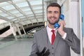 Businessman using traditional pay phone Royalty Free Stock Photo