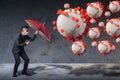 The businessman using an umbrella for defending coronavirus pandemic. the concept of insurance, protection, business and health ca