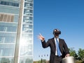 Businessman using virtual reality glasses in a business center Royalty Free Stock Photo