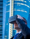 Businessman using virtual reality glasses in a business center a Royalty Free Stock Photo