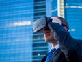 Businessman using virtual reality glasses in a business center a Royalty Free Stock Photo