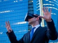 Businessman using virtual reality glasses in a business center a Royalty Free Stock Photo