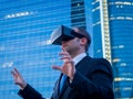 Businessman using virtual reality glasses in a business center a Royalty Free Stock Photo