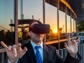 Businessman using virtual reality glasses in a business center Royalty Free Stock Photo