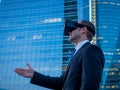 Businessman using virtual reality glasses for a meeting in cyberspace.