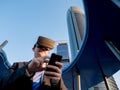 Businessman using virtual reality glasses with a mobile phone in Royalty Free Stock Photo