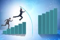 Businessman vault jumping over bar charts Royalty Free Stock Photo