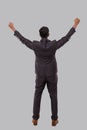 Businessman Very Happy and Excited, Raising arms, Celebrating a Victory or Success View from Back. Winner Sign. Indian Business Royalty Free Stock Photo