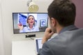 Businessman on video conference with her colleague in office job