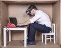 Businessman in virtual reality glasses working persistently on the laptop Royalty Free Stock Photo