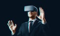 Businessman in virtual reality headset over black Royalty Free Stock Photo