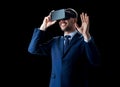 Businessman in virtual reality headset over black Royalty Free Stock Photo