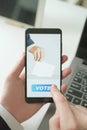 Businessman Voting Online by Smartphone