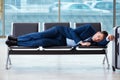 Businessman waiting at the airport for his plane in business cla Royalty Free Stock Photo