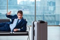 Businessman waiting at the airport for his plane in business cla Royalty Free Stock Photo