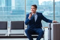 Businessman waiting at the airport for his plane in business cla Royalty Free Stock Photo