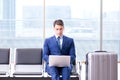 Businessman waiting at the airport for his plane in business cla Royalty Free Stock Photo