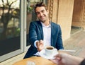 Businessman, waitress and hand or coffee as customer service for pov or outdoor cafe or restaurant, relax or caffeine Royalty Free Stock Photo