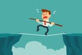 Businessman walk on rope across cliff gap