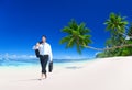 Businessman Walking Along Tropical Beach Concept Royalty Free Stock Photo