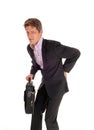 Businessman walking with back pain. Royalty Free Stock Photo