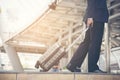 Businessman walking in the city with the suitcase. Travel Business Lifestyle