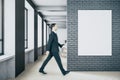 Businessman walking in coworking loft interior