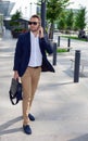 Businessman walking down the street with a briefcase Royalty Free Stock Photo