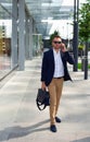 Businessman walking down the street with a briefcase Royalty Free Stock Photo