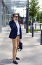 Businessman walking down the street with a briefcase Royalty Free Stock Photo