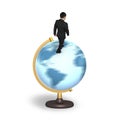 Businessman walking on globe with world map Royalty Free Stock Photo