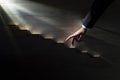 Businessman walking his fingers up wooden steps towards the light Royalty Free Stock Photo