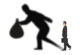 Businessman walking and holding bag with thief shadow Royalty Free Stock Photo
