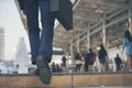 Businessman walking with luggage in business trip. Focus on man legs boarding travel arrival terminal. Business travel trip Royalty Free Stock Photo