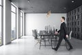 Businessman walking in modern coworking office interior Royalty Free Stock Photo