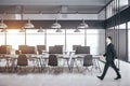 Businessman walking in modern coworking office interior Royalty Free Stock Photo