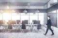 Businessman walking in modern coworking office interior Royalty Free Stock Photo