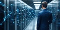 Businessman walking in modern server room exploring digital network connections, visualizing data flow and cybersecurity in