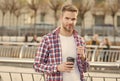 businessman walking outdoor. smart casual dressed person drinking coffee mug outdoor. Caucasian male resting in street Royalty Free Stock Photo