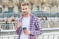Businessman walking outdoor. smart casual dressed person drinking coffee mug outdoor. Caucasian male resting in street Royalty Free Stock Photo
