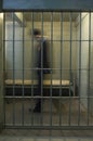 Businessman Walking In Prison Cell Royalty Free Stock Photo