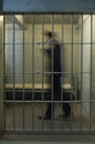 Businessman Walking In Prison Cell Royalty Free Stock Photo