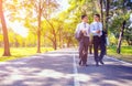 Businessman,They are walking on road in park.They are talking  business. Royalty Free Stock Photo