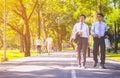 Businessman,They are walking on road in park.They are talking  business. Royalty Free Stock Photo